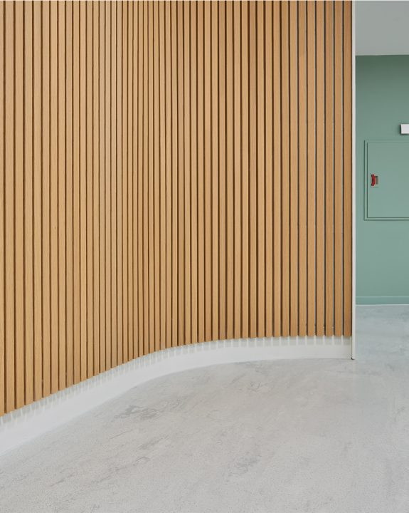 Colorful rib's creating a curved slatted wall