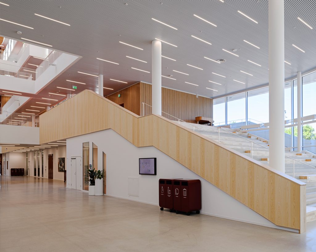 Staircase clad with microperforated acoustic wood panels