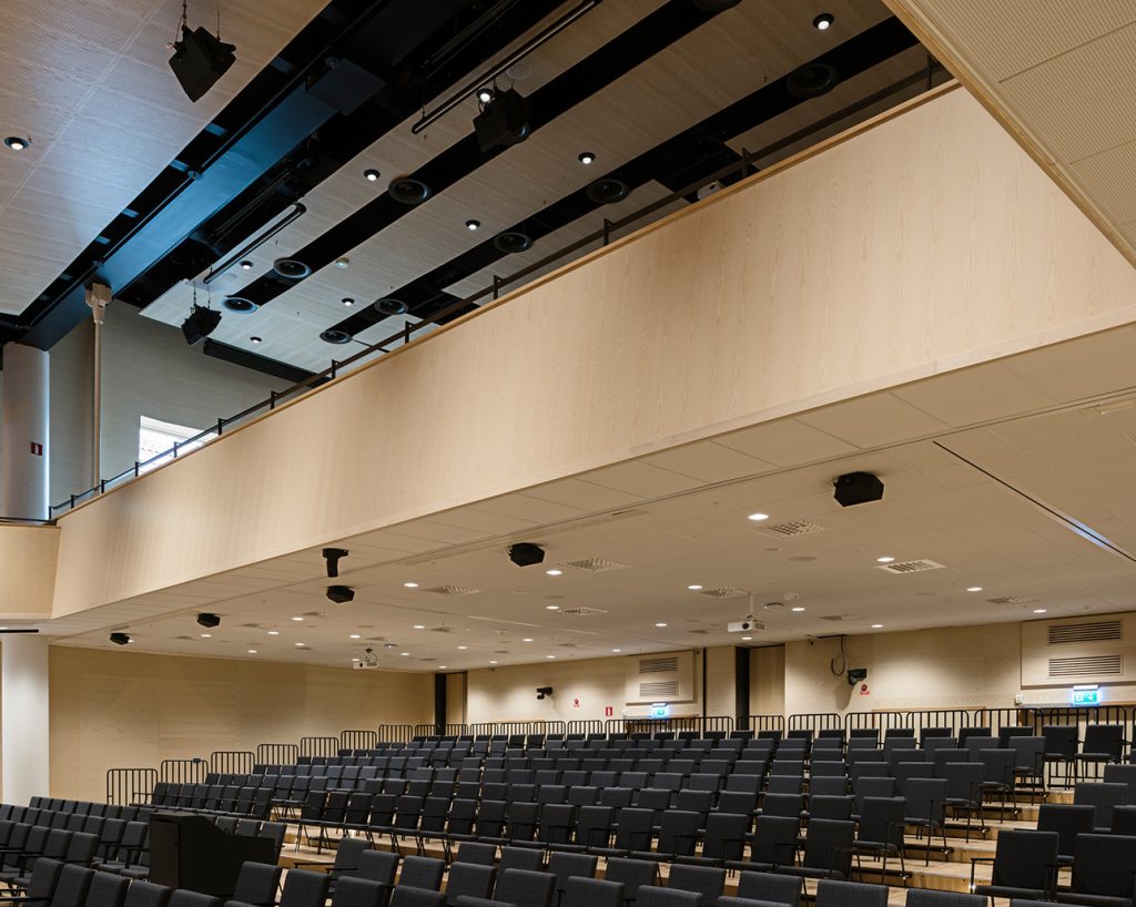 Ash veneered acoustic panels in auditorium