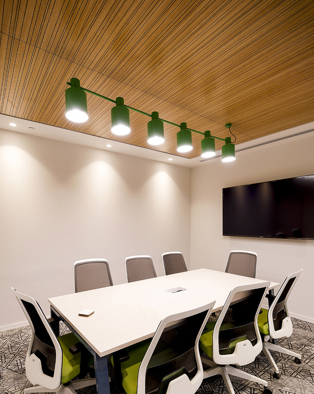 Grooved acoustic panel in ceiling