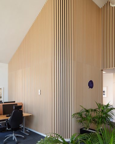 Acoustic wood slats curved wall in modern office
