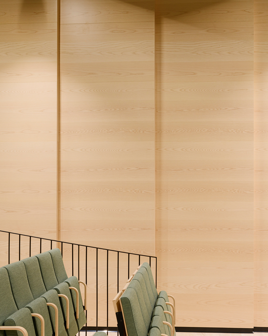 Microperforated wood panels mounted on wall