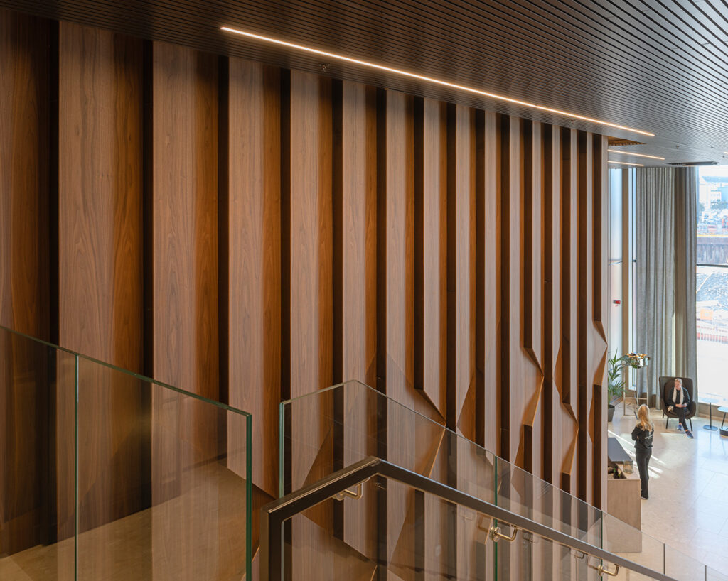 Walnut panelled wall from second floor