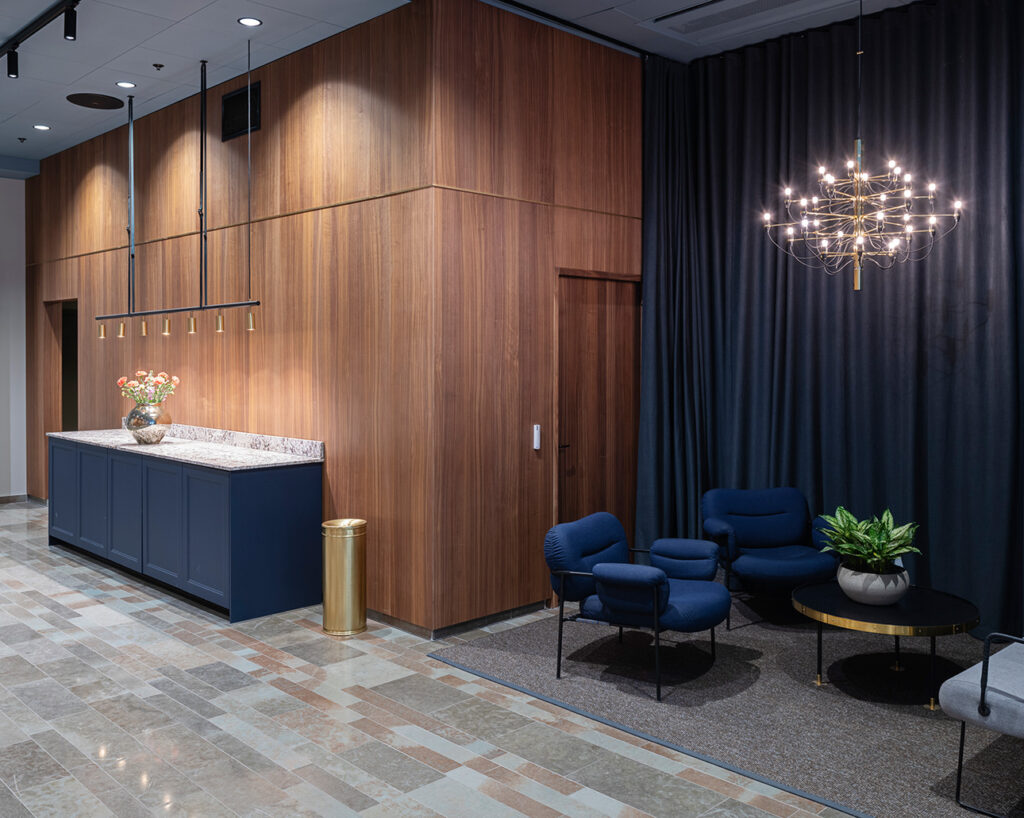 Blue velvet lounge and walnut panels