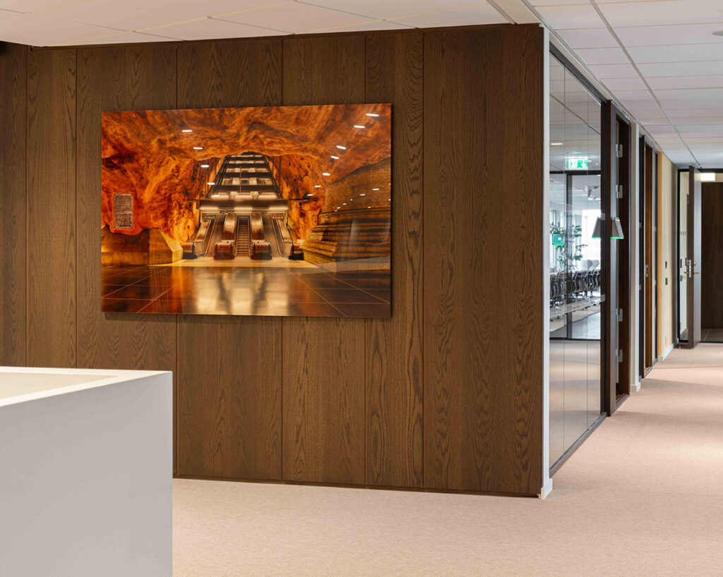 Art on wall with wooden panelling