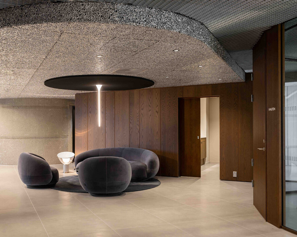 Lounge area with wooden panels on wall