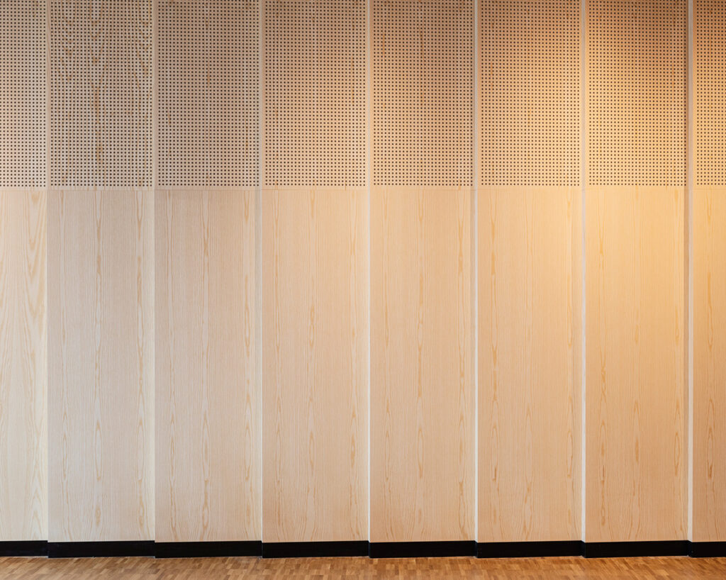 Pleated wall with perforated and plain panels