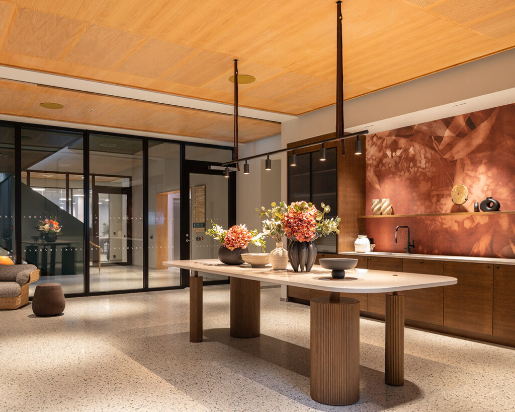 Rounded table and ceiling panels in oak