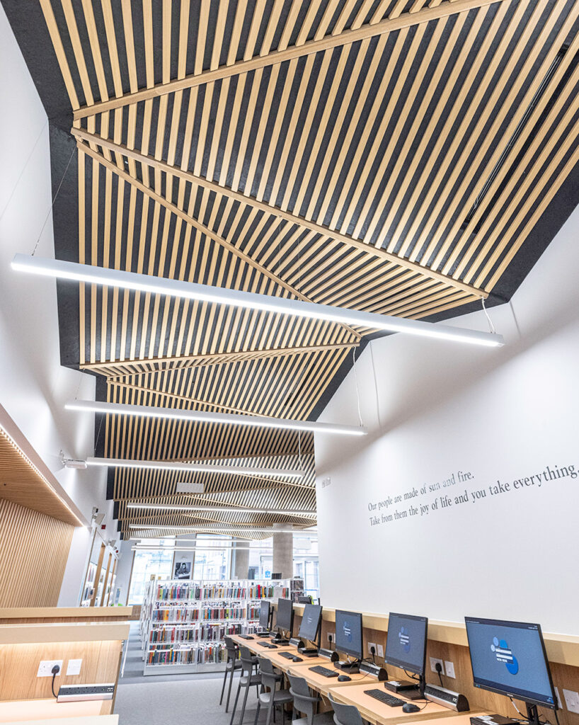 Computers at library and diamond patterned ceiling