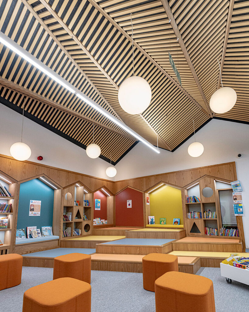 Kids area in library with oak ribs mounted in ceiling