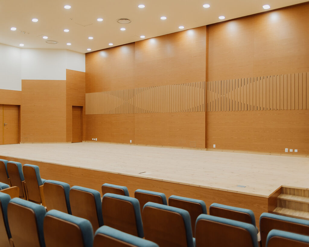 Cherry veneered stage from seats