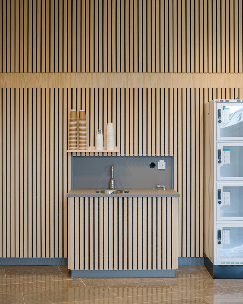 Water station clad in linear ribs