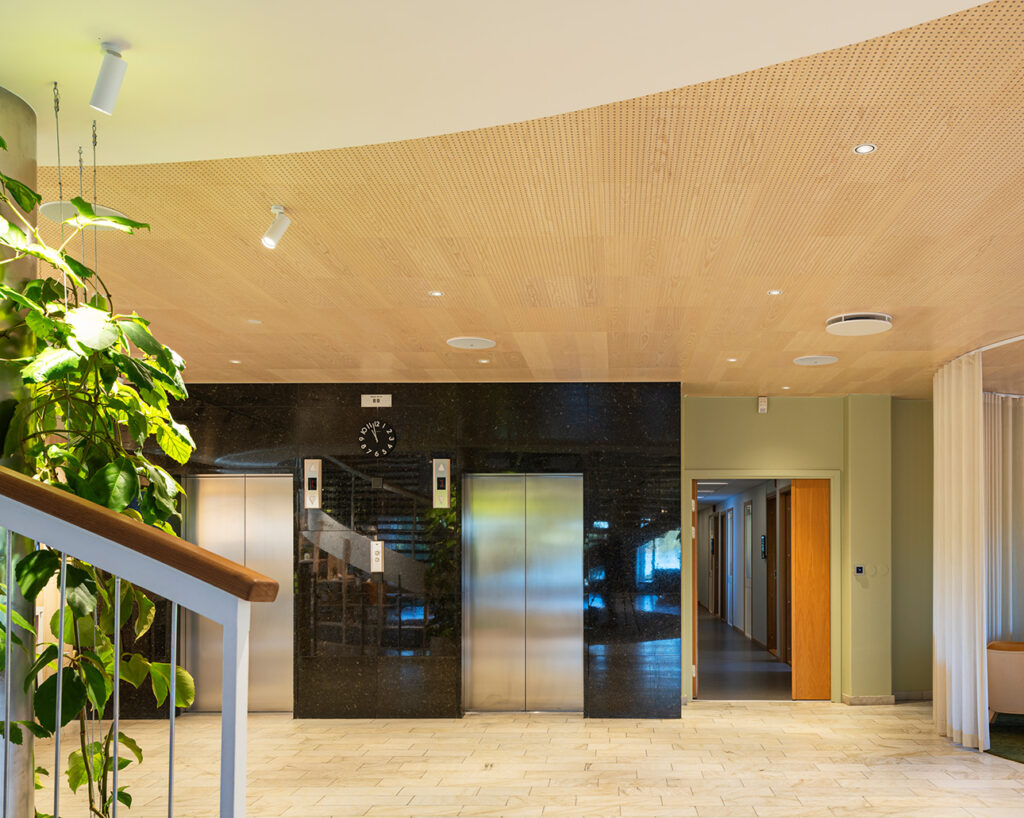 Perforated panels by elevators