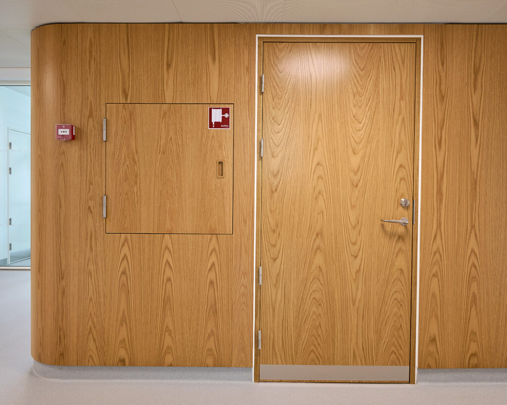Wall panels with integrated door and hatch