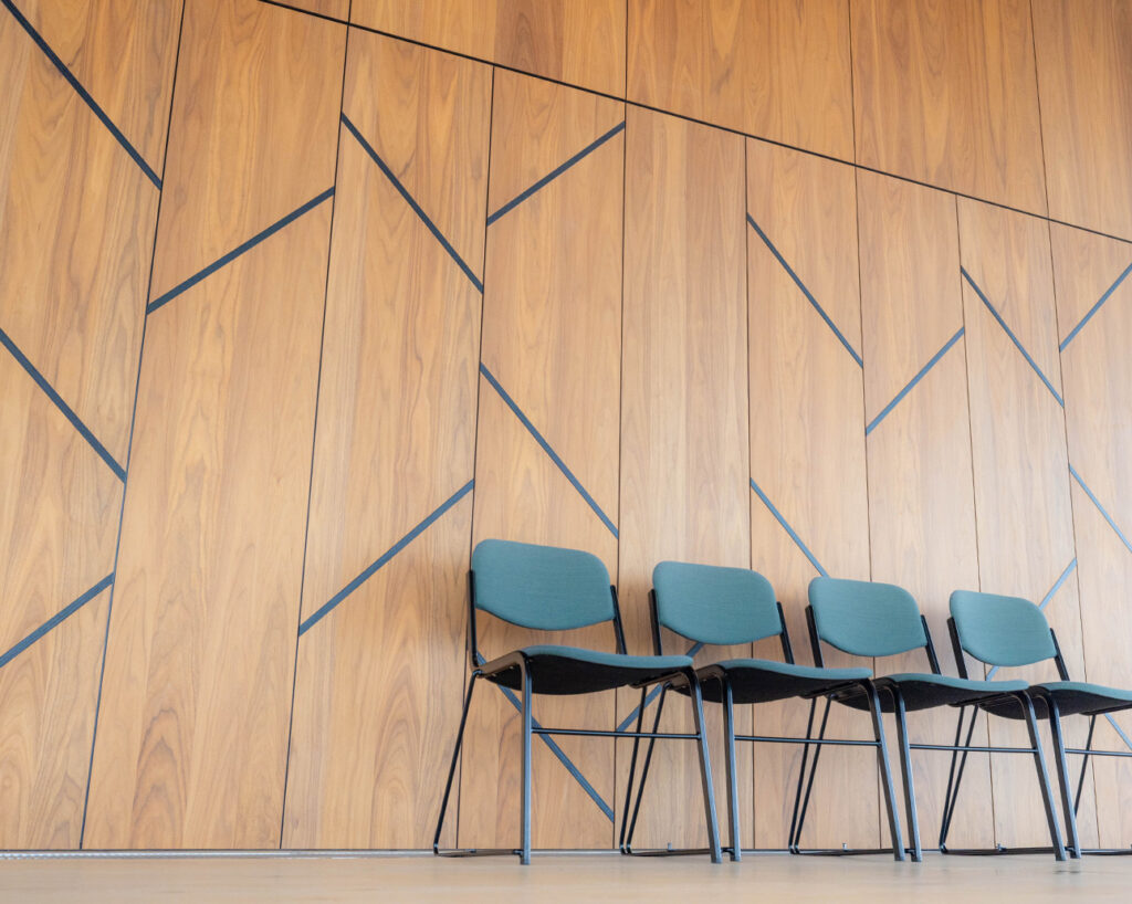 Chairs and panel wall in walnut