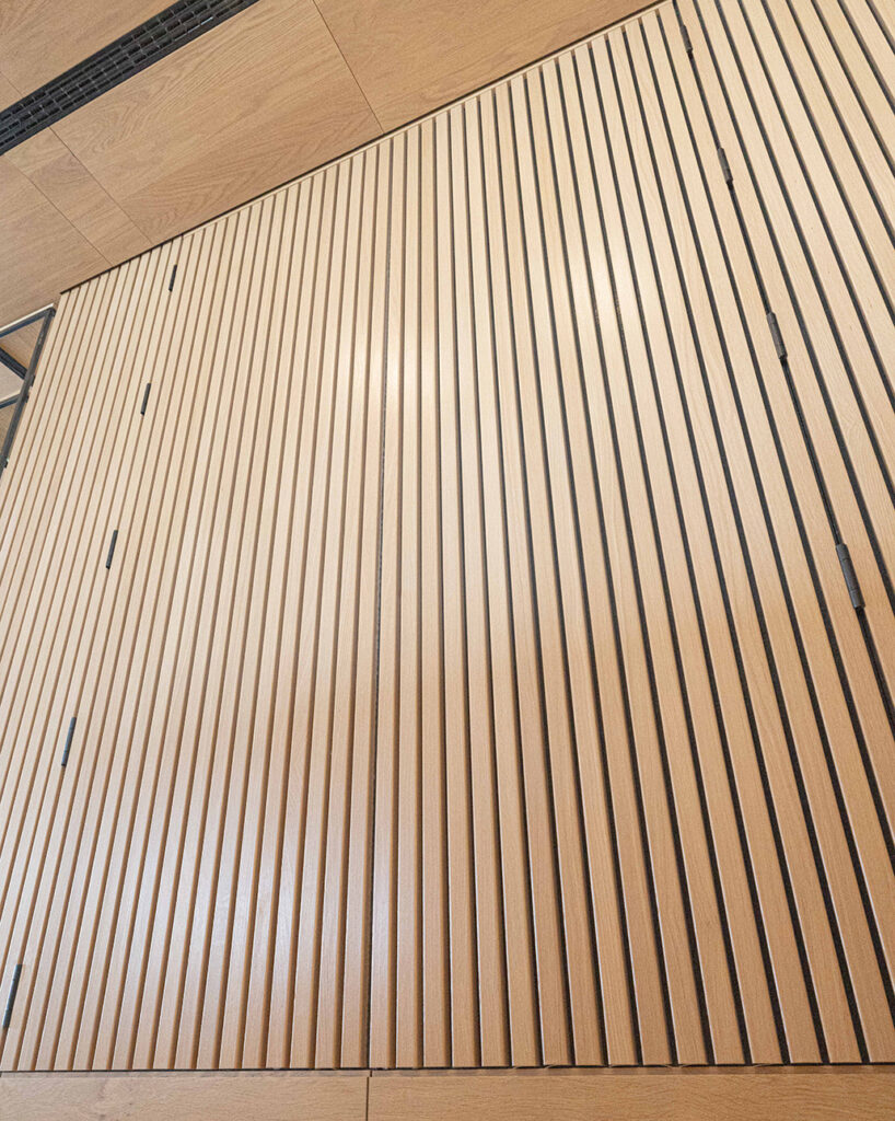 Linear Ribs in oak veneer on restaurant wall